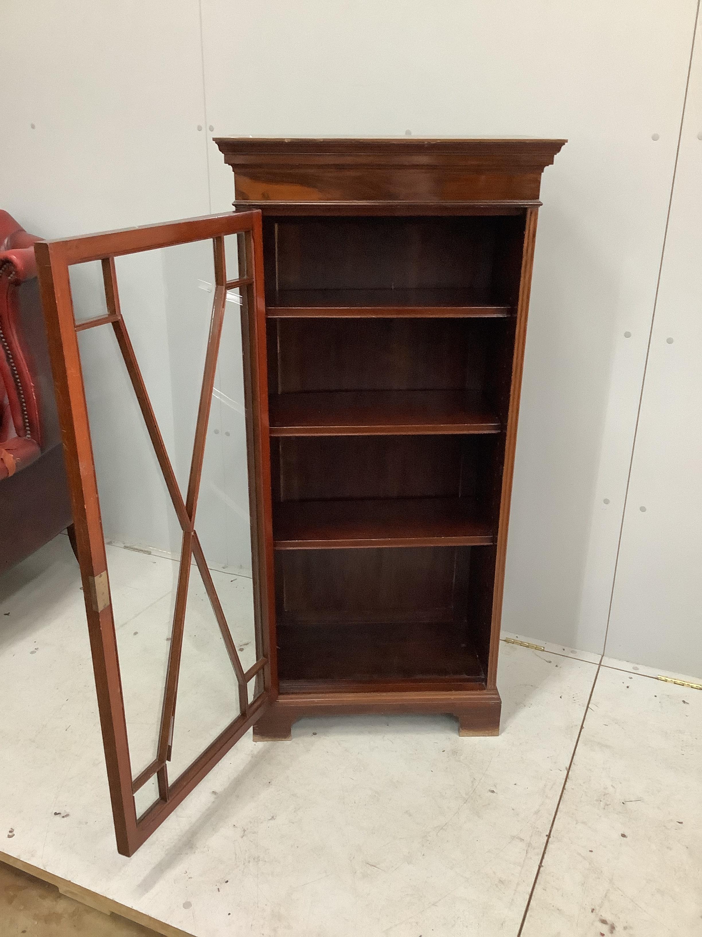 An Edwardian narrow mahogany glazed bookcase, width 63cm, depth 32cm, height 133cm